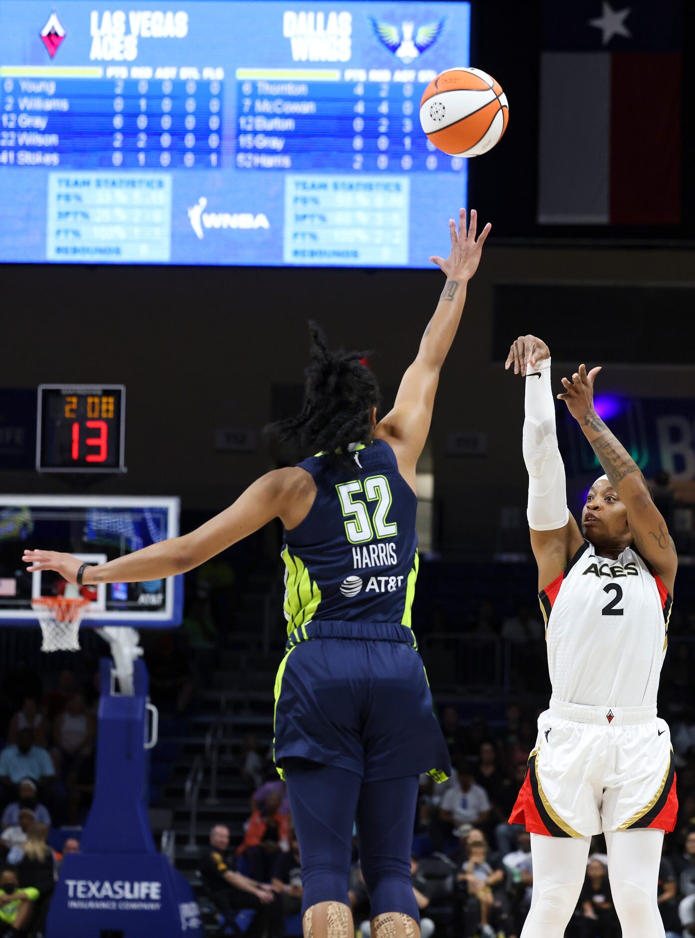 Las Vegas Aces guard Riquna Williams (2) shoots a three-pointer as Dallas Wings guard Tyasha...