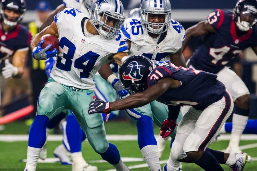 Dallas Cowboys running back Darius Jackson (34) is tackled by Houston Texans defensive back...