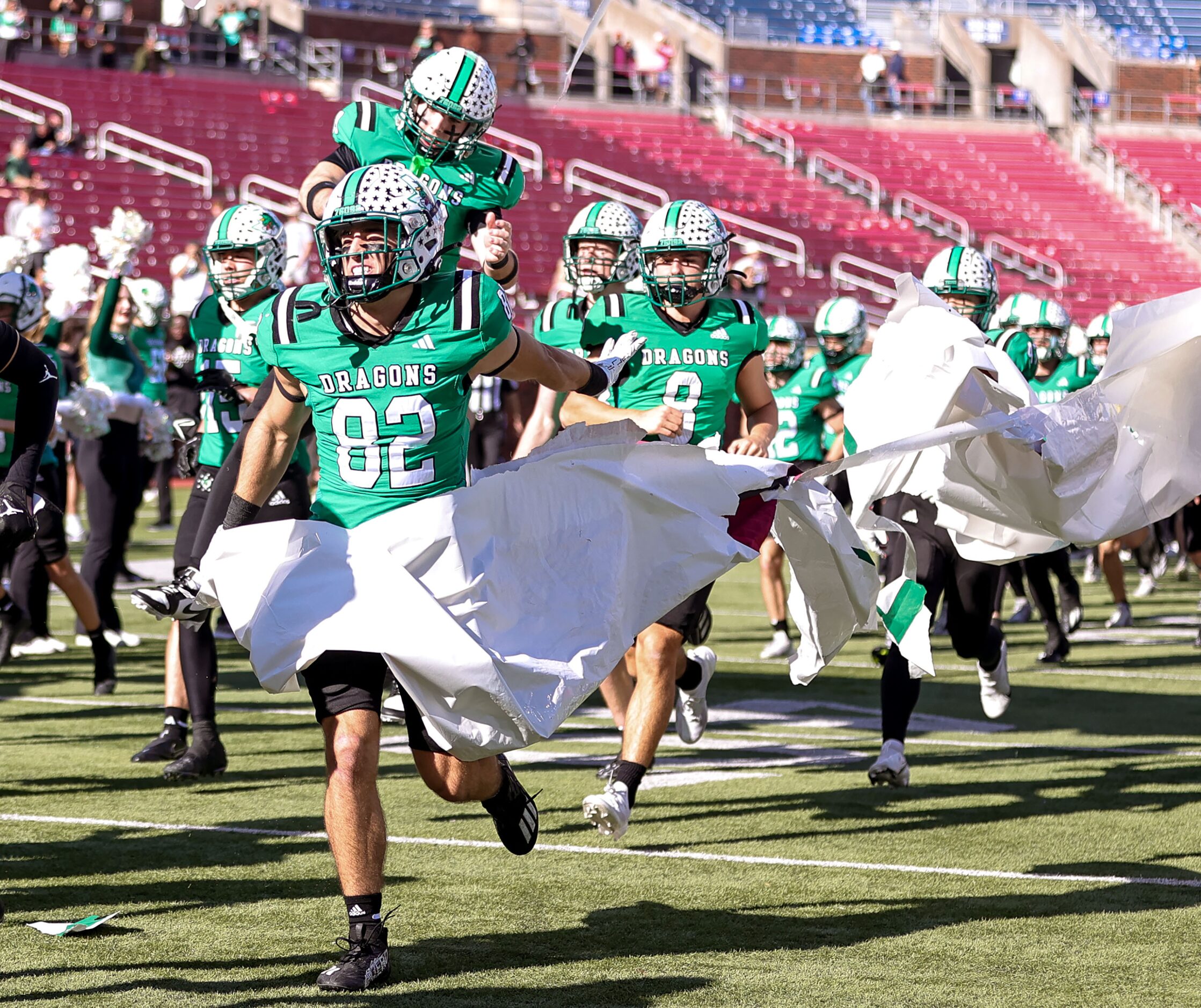 The Southlake Carroll Dragons enter the field to face Longview in a Class 6A Division II...