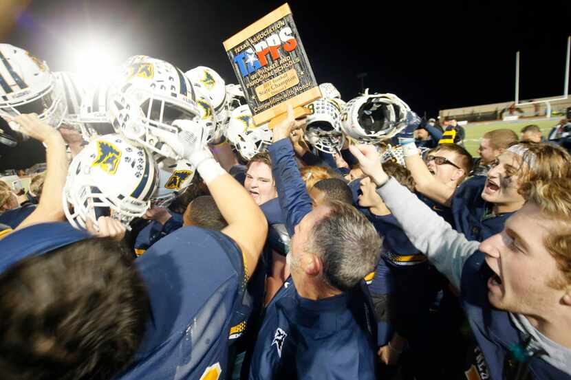Prestonwood Christian Academy football celebrates after winning the TAPPS Division 1 11-man...