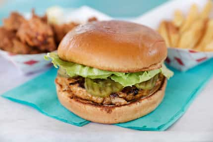 Ookuma's teriyaki burger is served with chicken karaage (back left) and sumo fries (right).