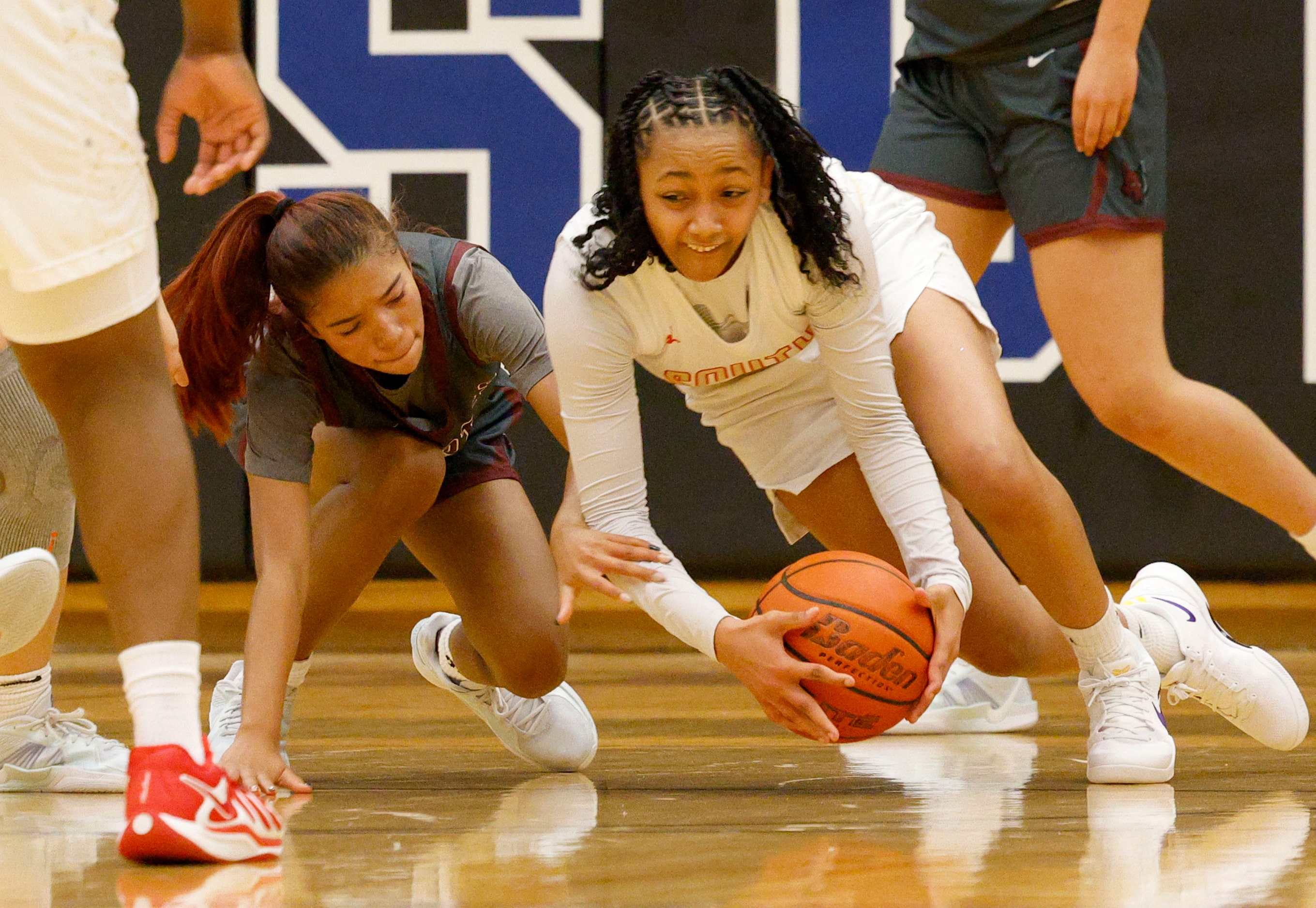 Frisco Heritage's Royal Crooks (5), left, and South Grand Prairie's Payton Garrett (2)...