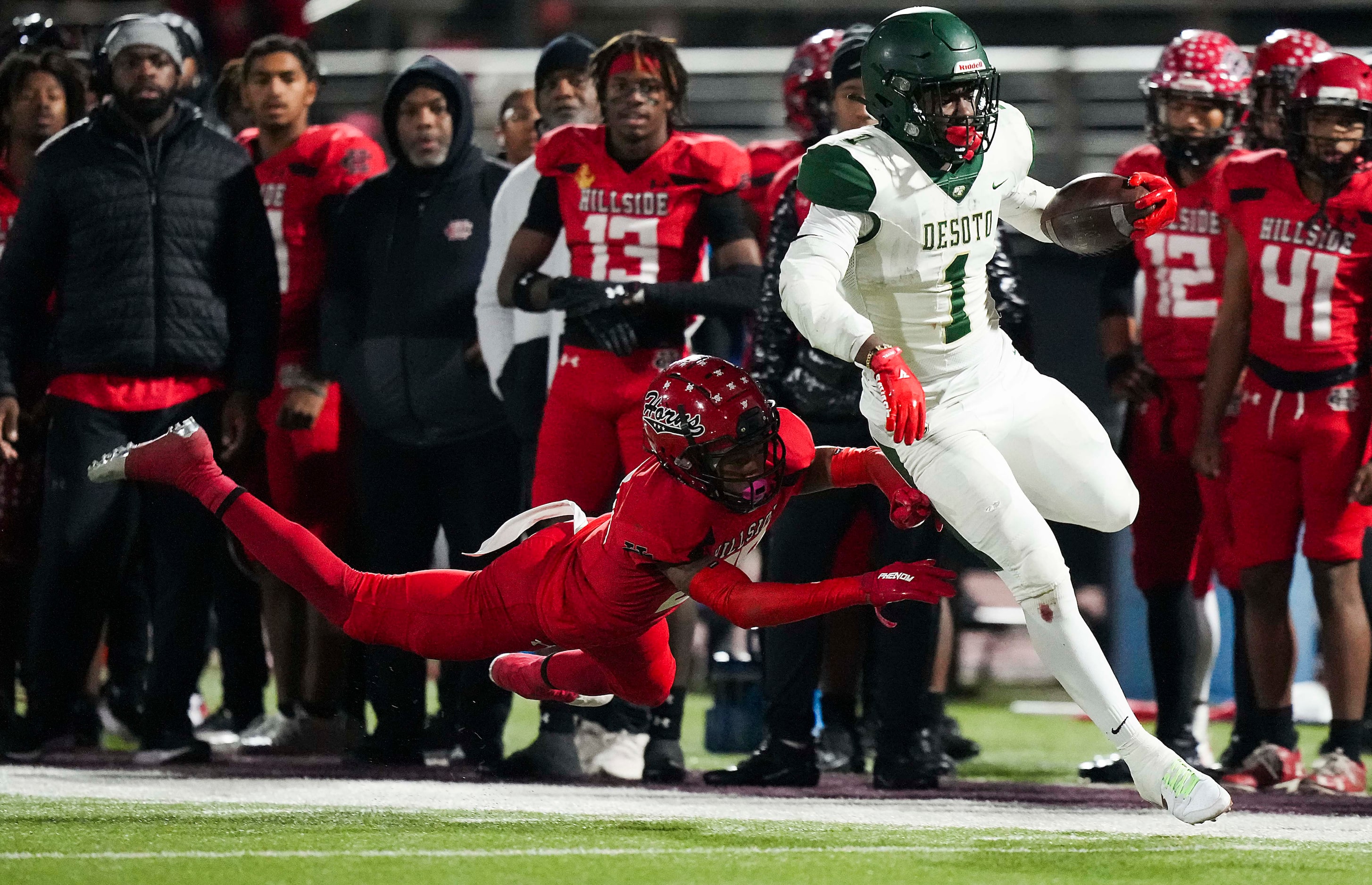 DeSoto running back Deondrae Riden Jr. (1) gets past Cedar Hill defensive back Michael...