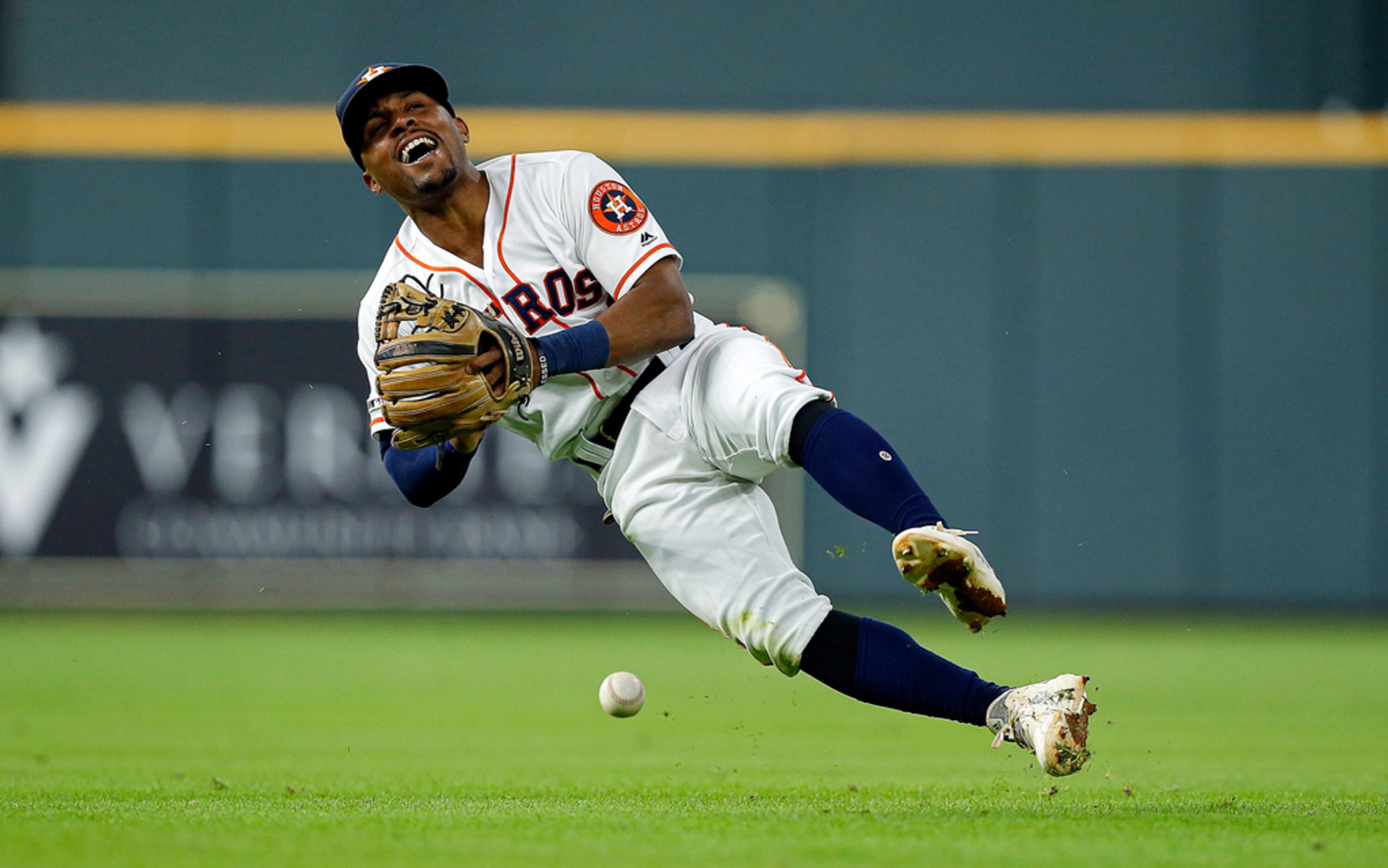 HOUSTON, TEXAS - JULY 20: Tony Kemp #18 of the Houston Astros can't come up with a ground...