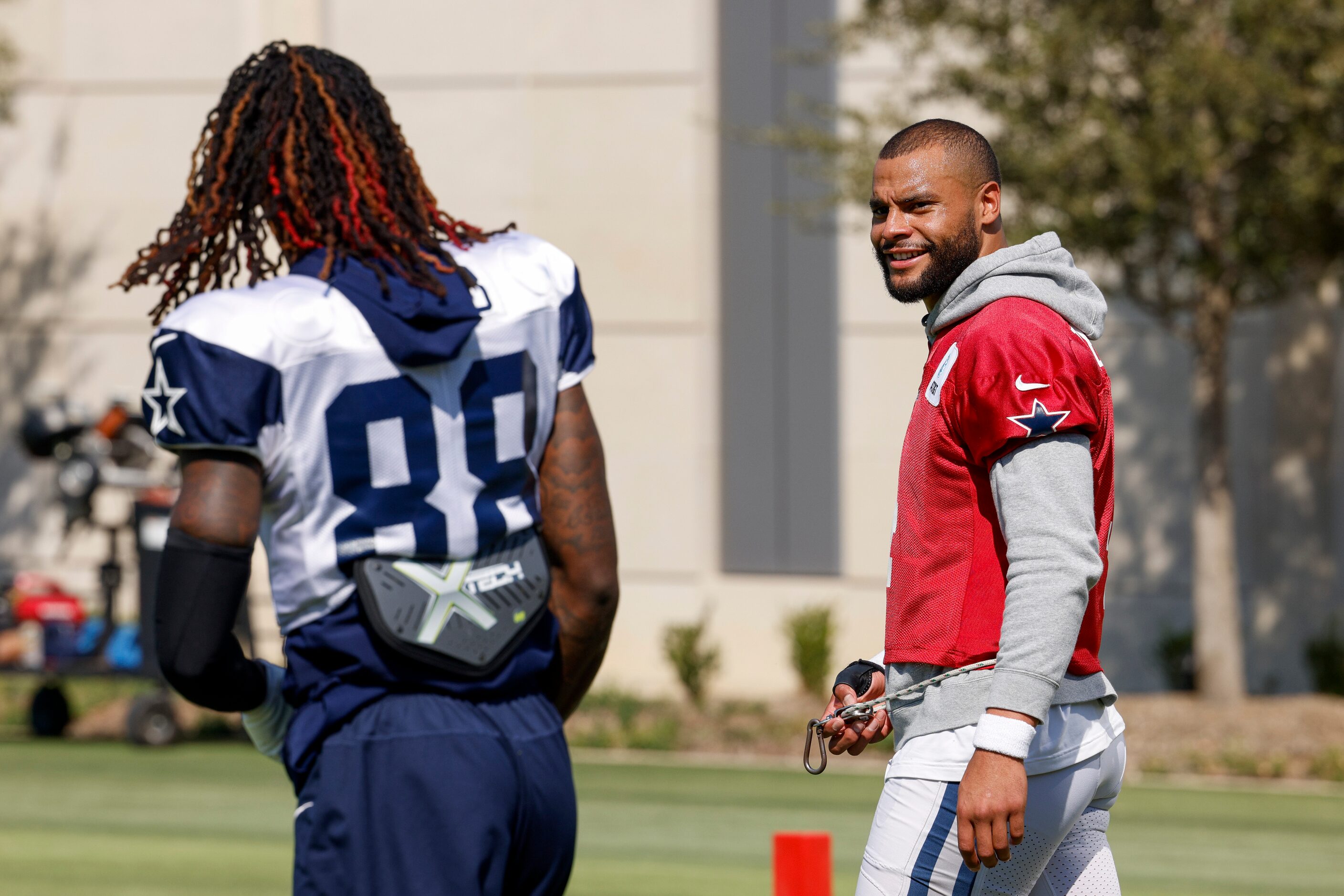 Dallas Cowboys quarterback Dak Prescott (4) talks with wide receiver CeeDee Lamb (88) during...