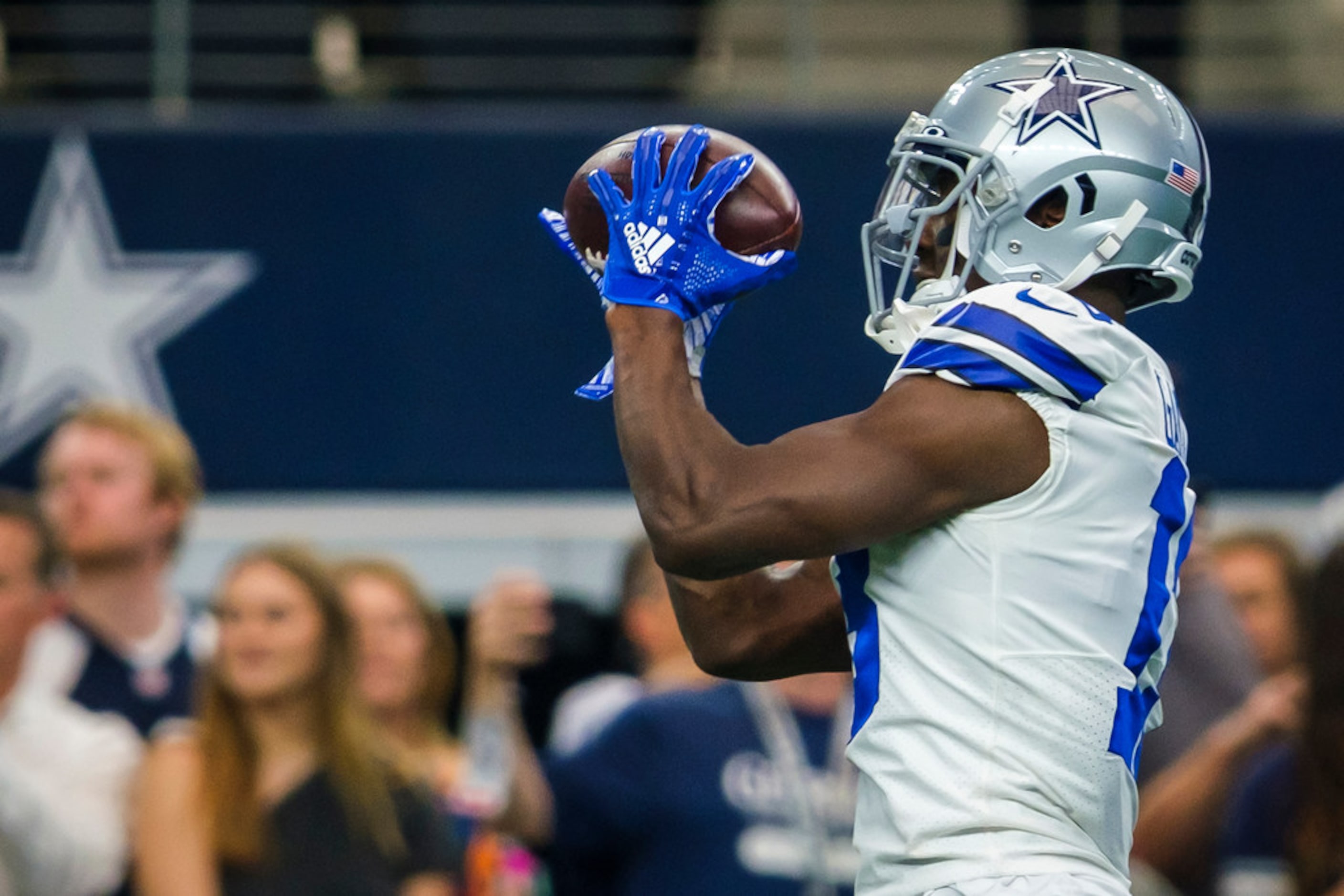 Dallas Cowboys wide receiver Michael Gallup (13) warms up before an NFL football game...