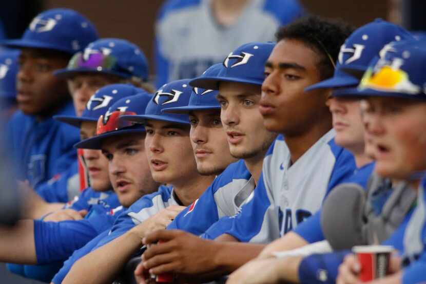 Hebron players hang on every pitch from the team dugout during the 3rd inning of play...