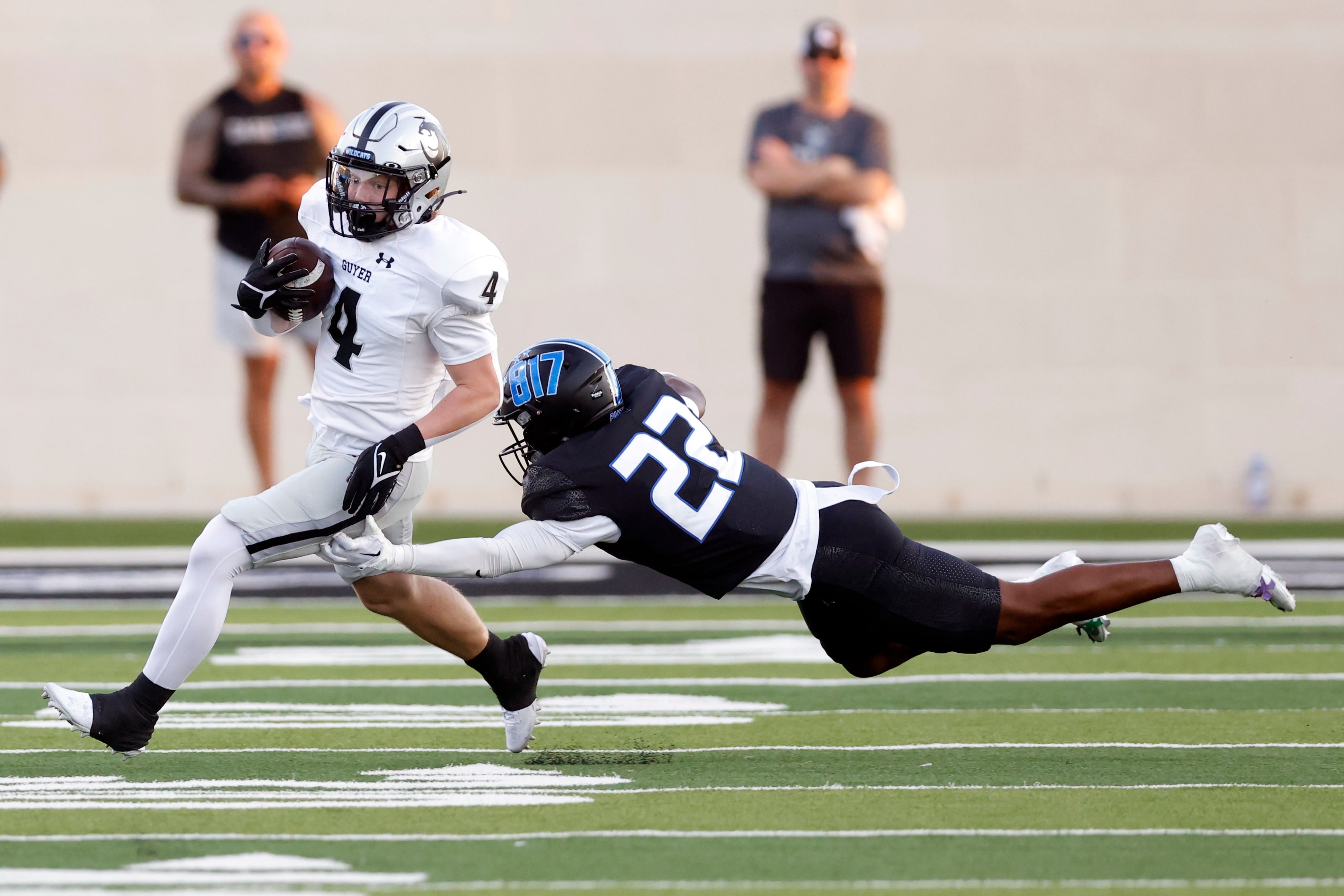 North Crowley defensive back Gaylon McNeal (22) dives to tackle Denton Guyer running back...