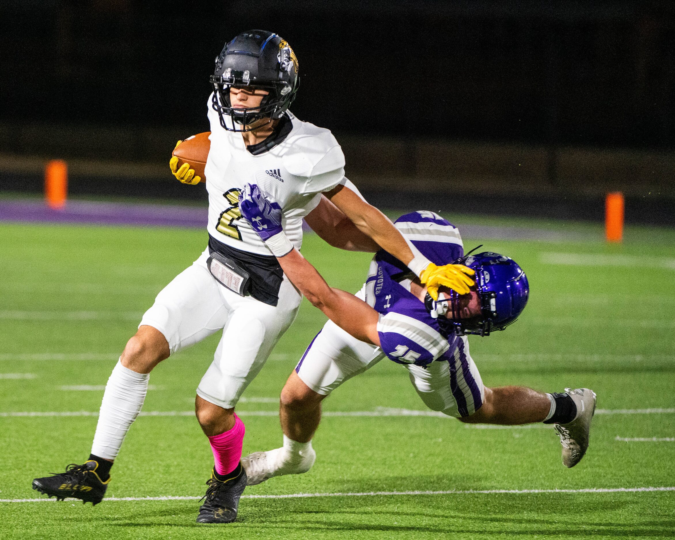 Kaufman’s Hayden Robbins (2) is is tackled by Anna’s Jamison Adams (15) in the first half...