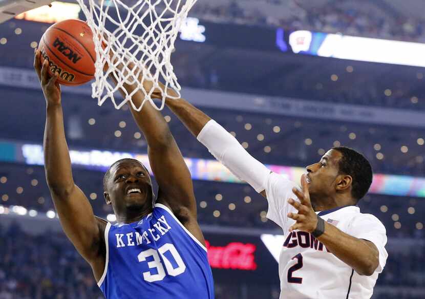 Kentucky Wildcats forward Julius Randle (30) goes up against Connecticut Huskies forward...