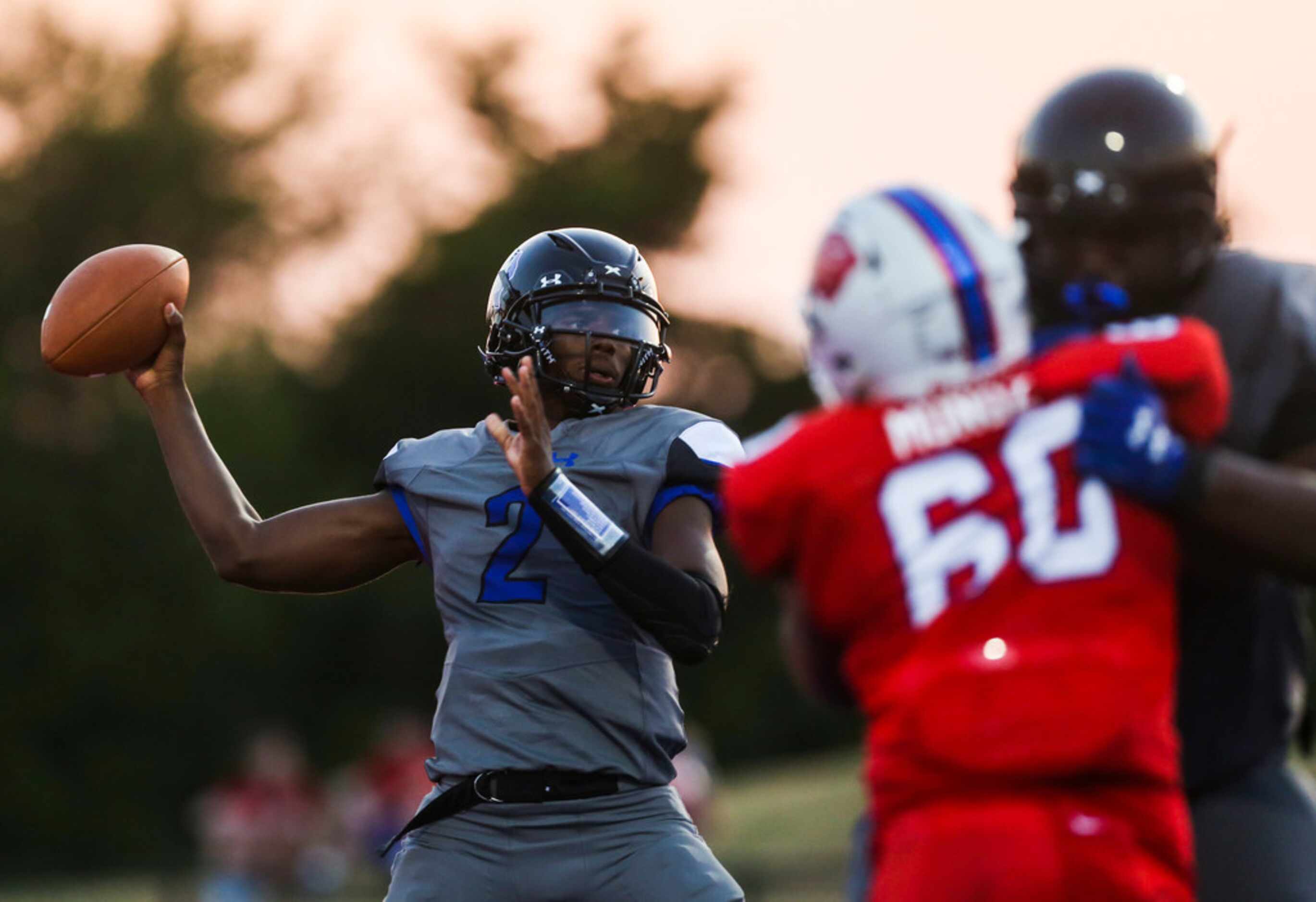 Trinity Christian-Cedar Hills quarterback Shedeur Sanders (2) fires off a pass during a high...