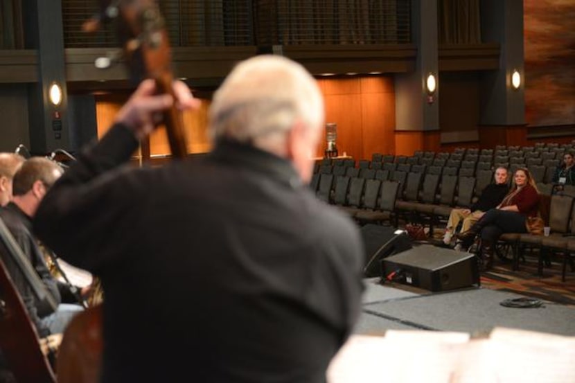 
John Worster, a 1950s jazz bassist, (lower right) listens in on a sound check at the Hyatt...