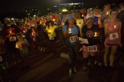  A run and candlelight vigil honoring David Stevens, the marathoner who was killed at random...