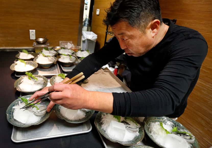 Chef Teiichi Sakurai prepares the sashimi course.