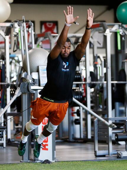 Texas' Tyrone Swoopes jumps during a workout at Michael Johnson Performance in McKinney on...