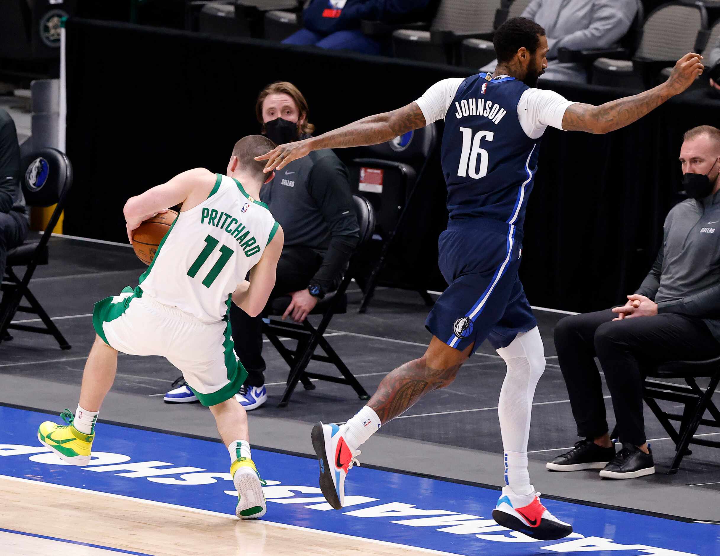 Dallas Mavericks forward James Johnson (16) fouls Boston Celtics guard Payton Pritchard (11)...