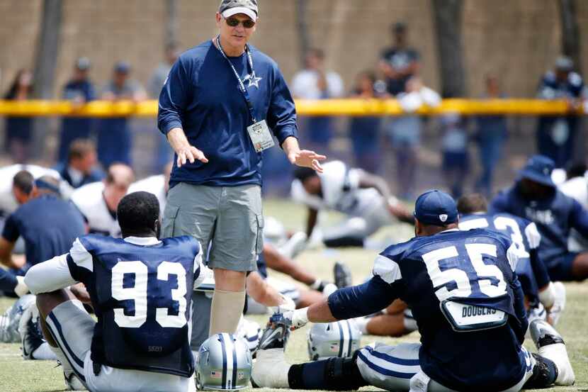 Dallas Cowboys defensive coordinator Rod Marinelli talks with Dallas Cowboys defensive end...