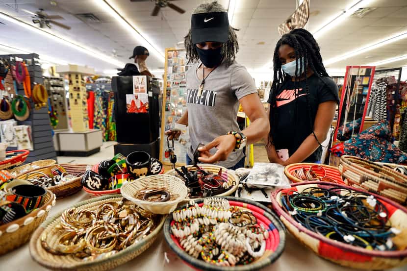 Charlene Turner and her niece Kamora, 12, of DeSoto, Texas shop at Pan-African Connection in...