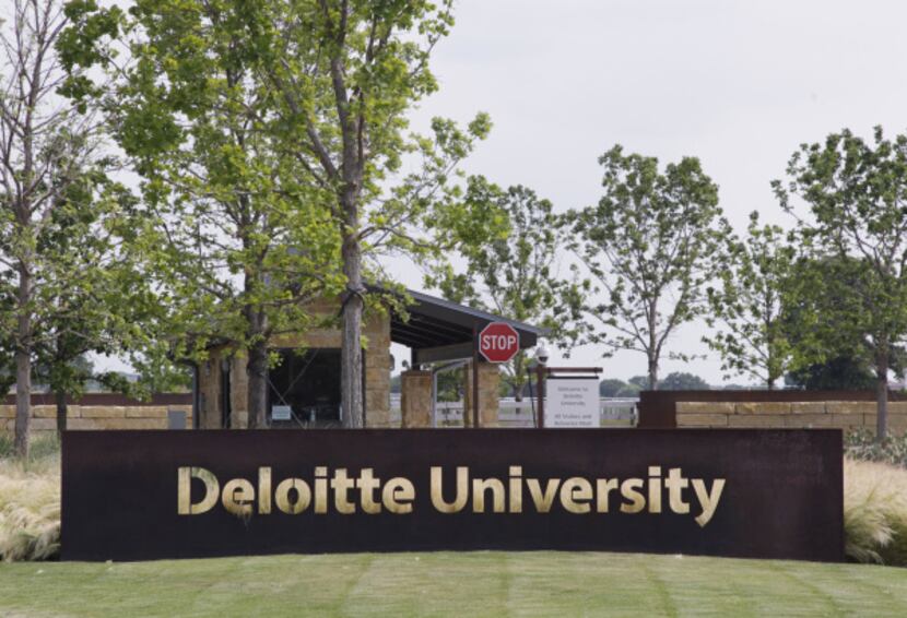 Trees surround the entrance to Deloitte University, which features high-tech training in a...