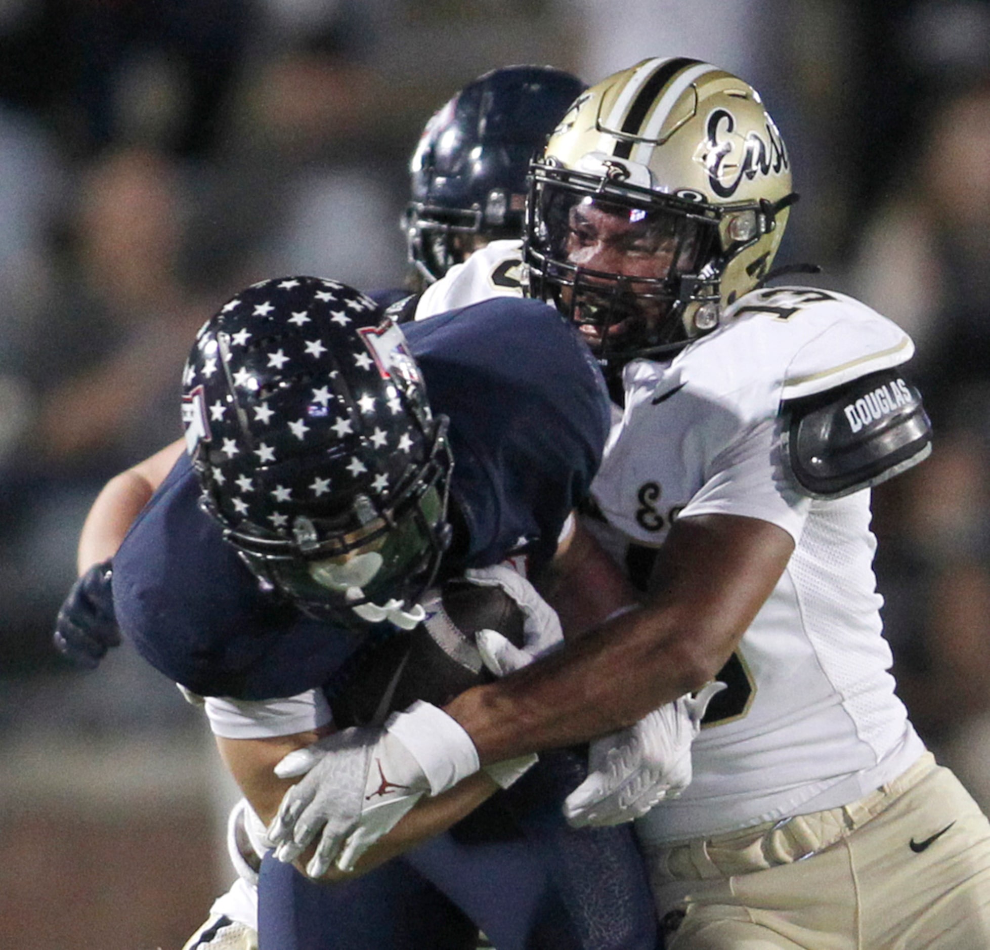 Plano East linebacker Jace Boutte (13), right, tackles Allen receiver Carter Harris (14)...