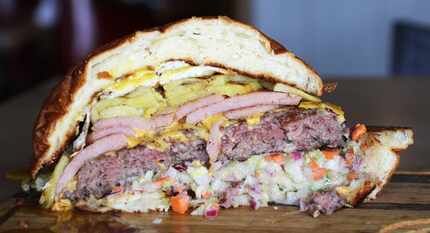 Once you cut into Slater's 50/50's Big Island Feast Burger, get ready: It'll topple over if...
