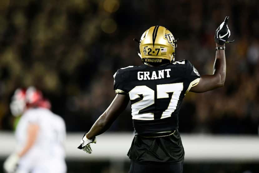 Richie Grant #27 of the UCF Knights celebrates after a tackle for a loss against the...