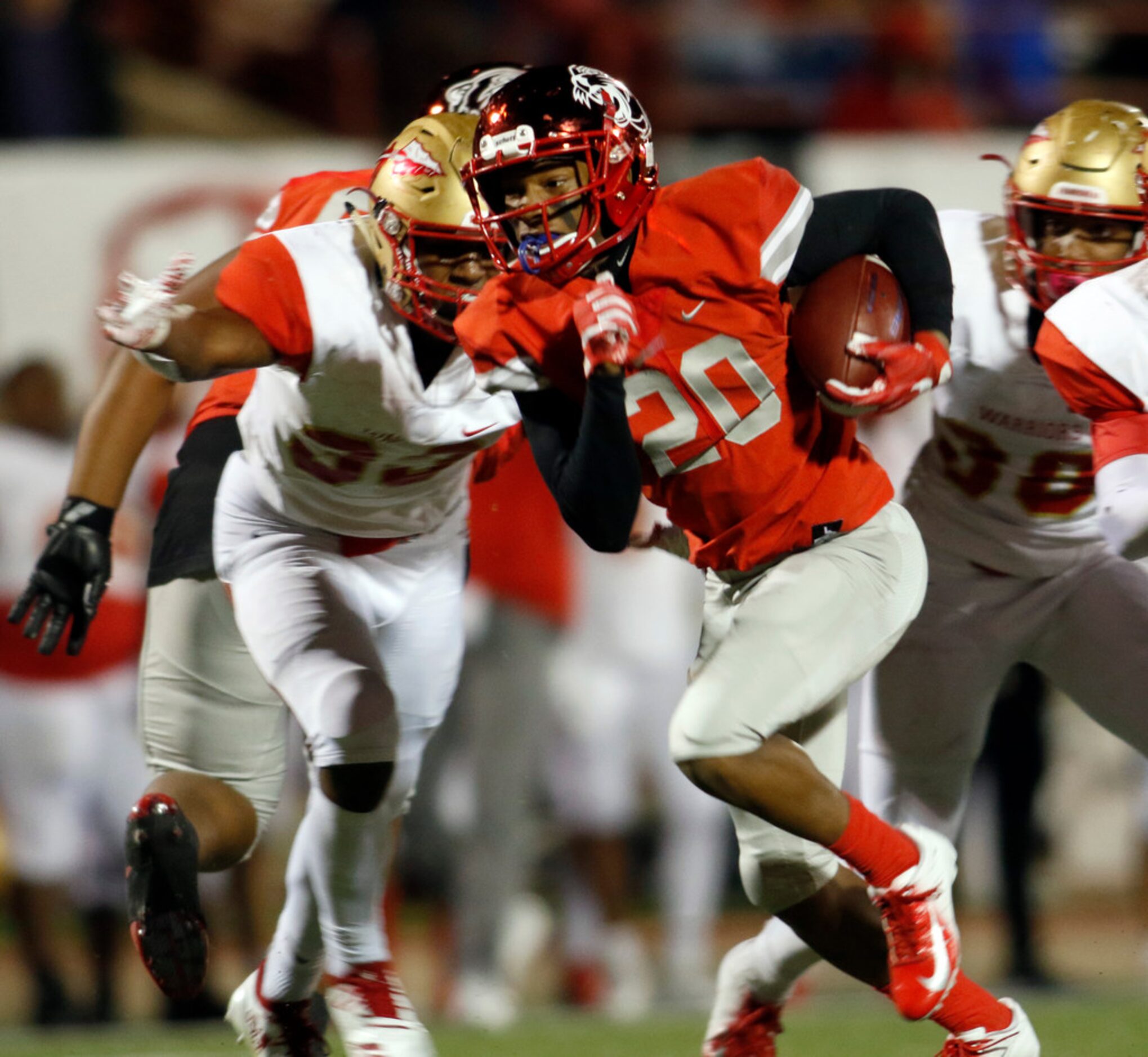 Duncanville Panthers running back Ja'von Fountain (20) bolts up the middle past the defense...