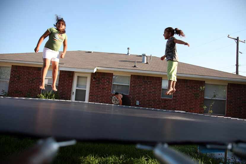 Children at play in a southern Dallas backyard.