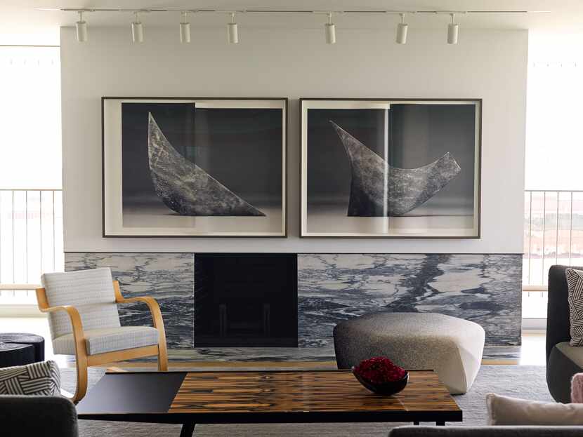 An archival pigment print by Erin Shirreff hangs above the marble fireplace.