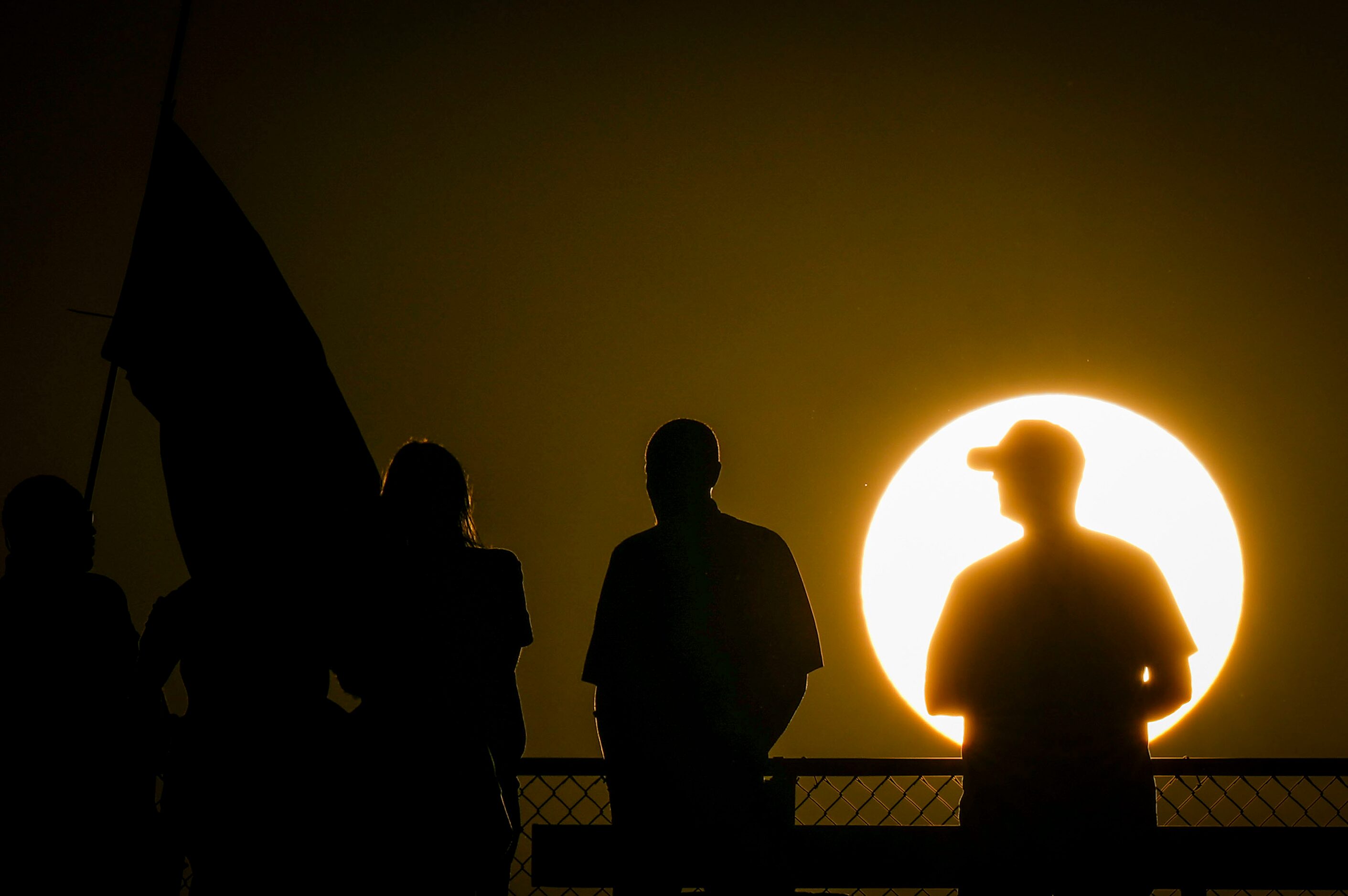 Fans watch Trophy Club Byron Nelson face Keller Fossil Ridge as the sun sets on a high...