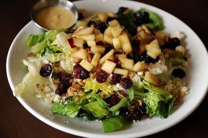 The Autumn Harvest Salad features romaine and butter lettuce, apples, feta, and dried...
