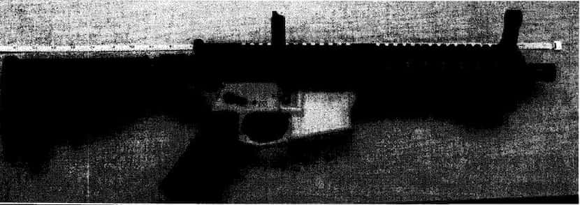 A photo from court documents showing the AR-15 style rifle that Eric McGinnis had in his...