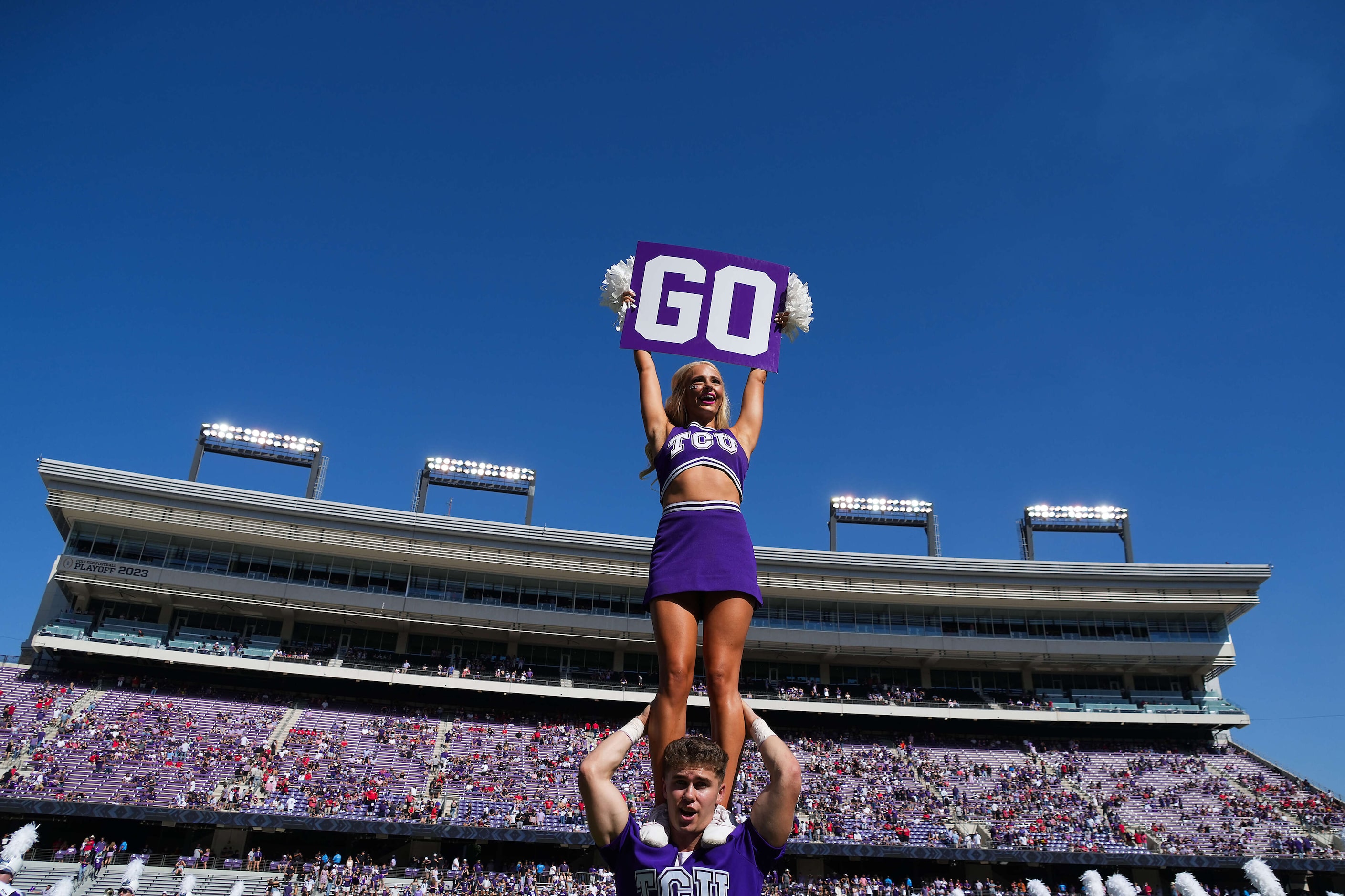 TCU cheerleaders fire up the crowd before an NCAA football game against Texas Tech on...