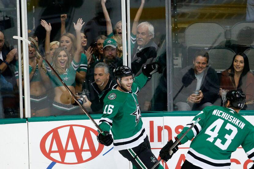 Dallas Stars center Jason Dickinson (16) celebrates his first goal with right wing Valeri...