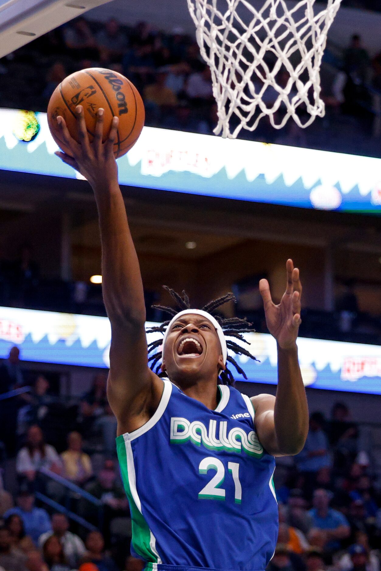 Dallas Mavericks guard Frank Ntilikina (21) lays the ball up during the second half of an...