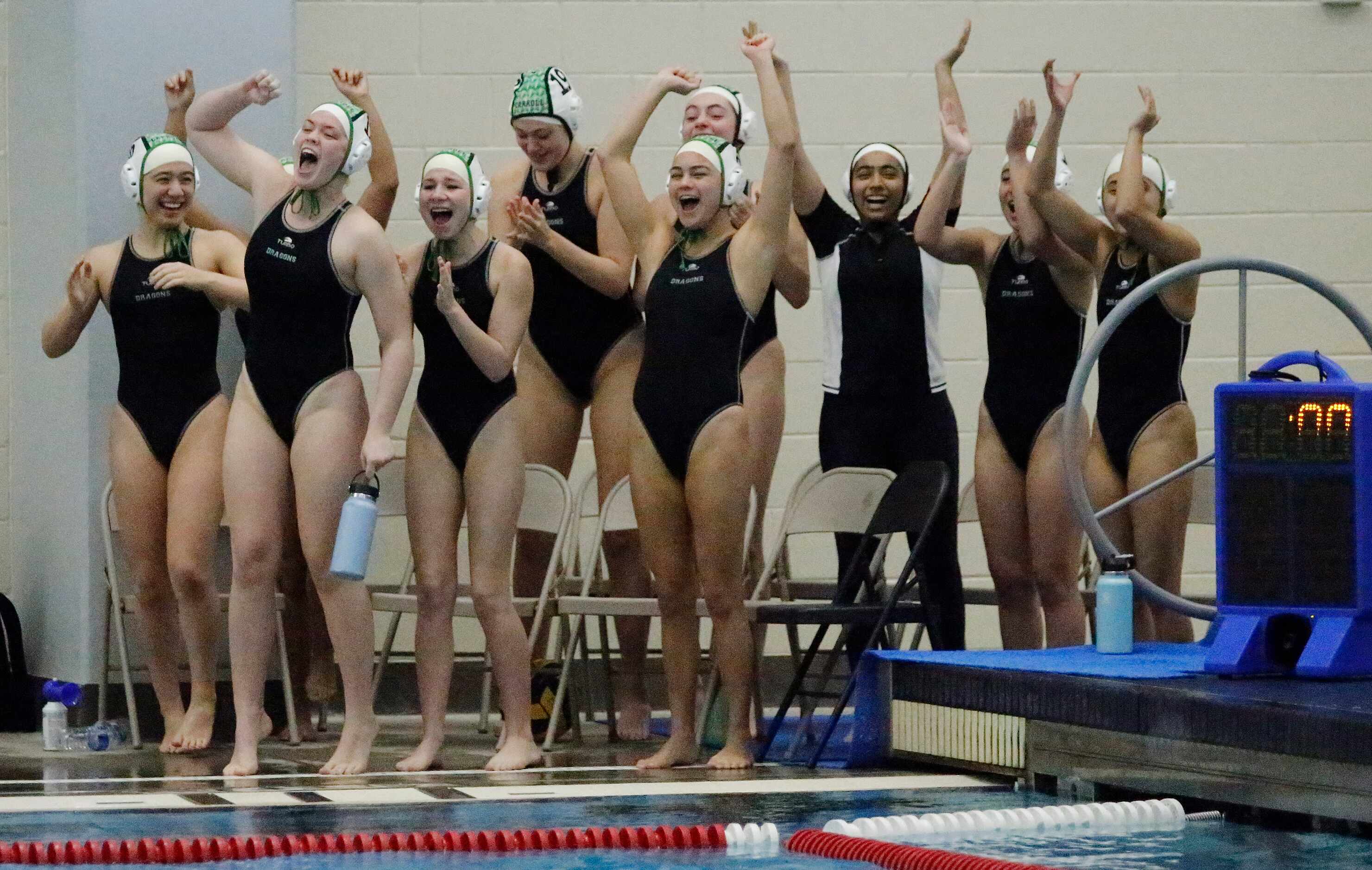 The Southlake bench celebrates when time runs out with a 12-10 lead as Southlake High School...