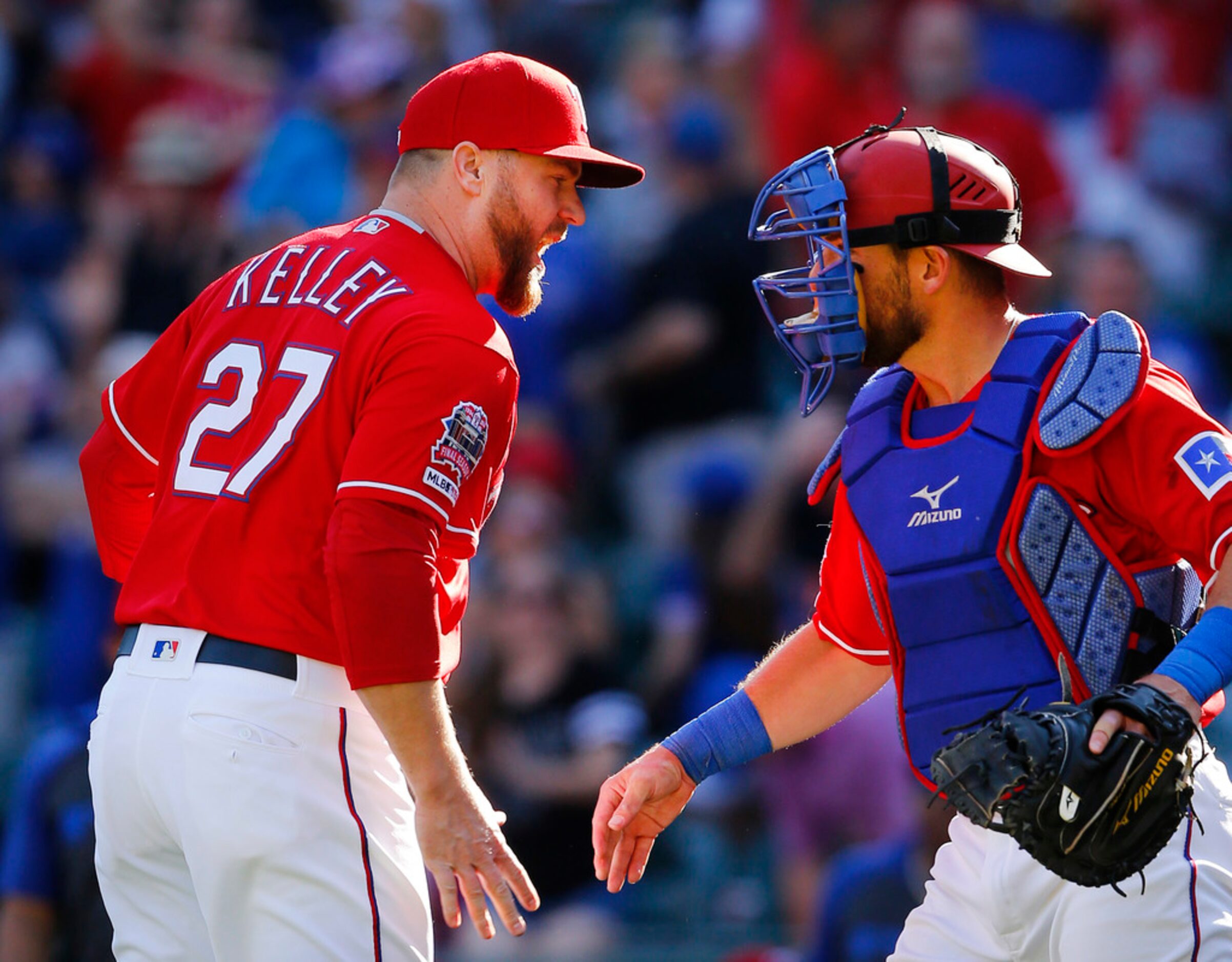 Texas Rangers relief pitcher Shawn Kelley is congratulated by catcher Jeff Mathis after...