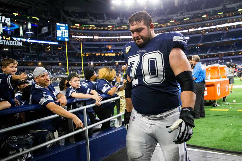 Dallas Cowboys offensive guard Zack Martin (70) leaves the field after a 28-14 lost to the...