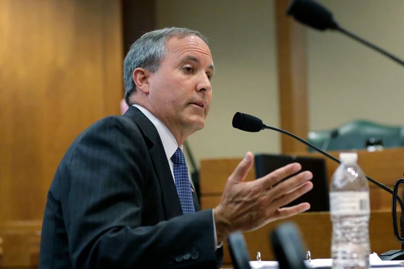 Texas Attorney General Ken Paxton speaks during a hearing in Austin in July.