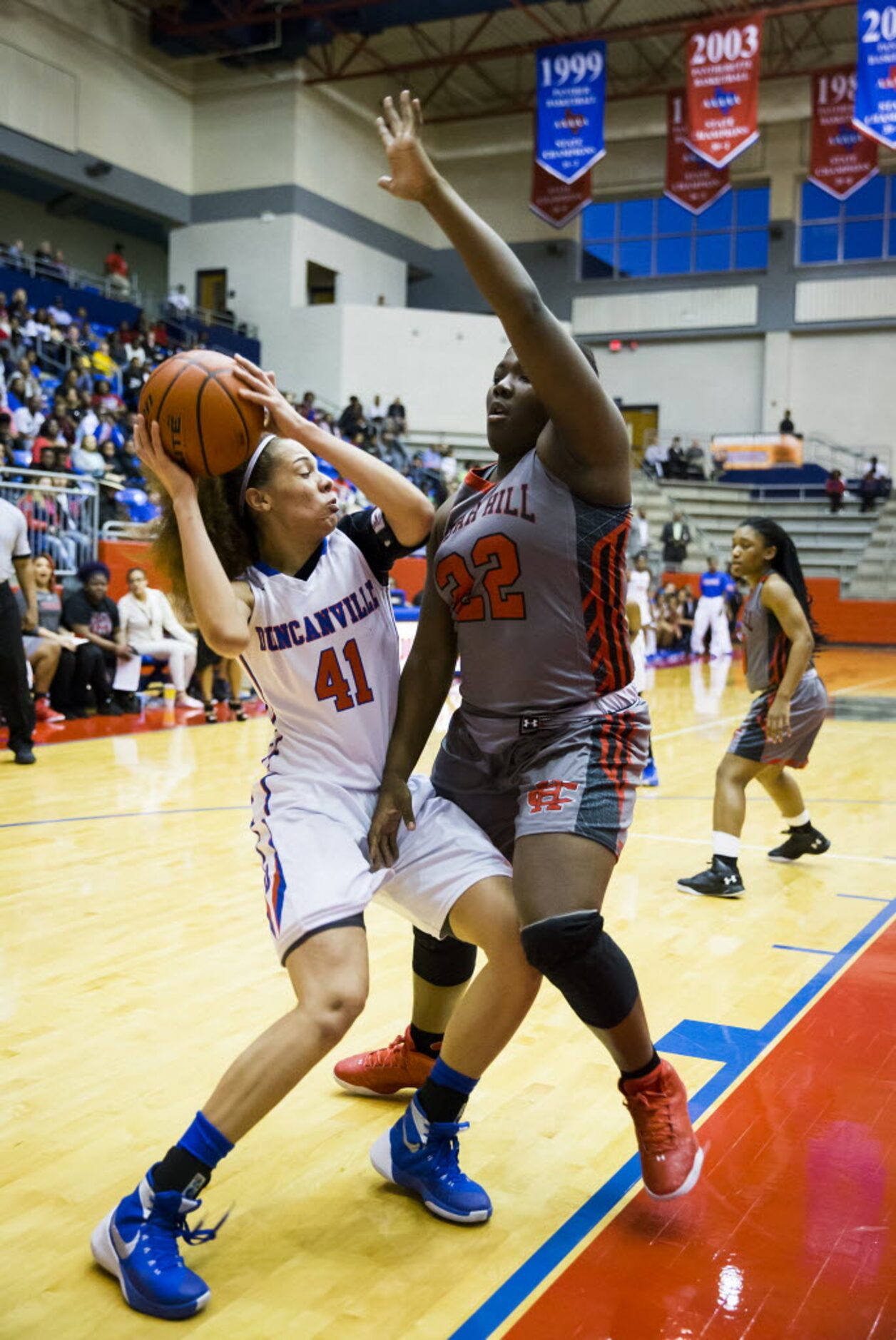 Duncanville forward Madison Townley (41) drives to the basket against Cedar Hill forward...