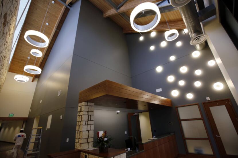 The front desk area of the new 56,000-square-foot Dallas Children's Advocacy Center is...