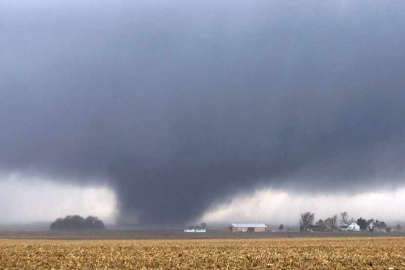 A tornado moves northeast Nov. 17, 2013, two miles west of Flatville, Ill.