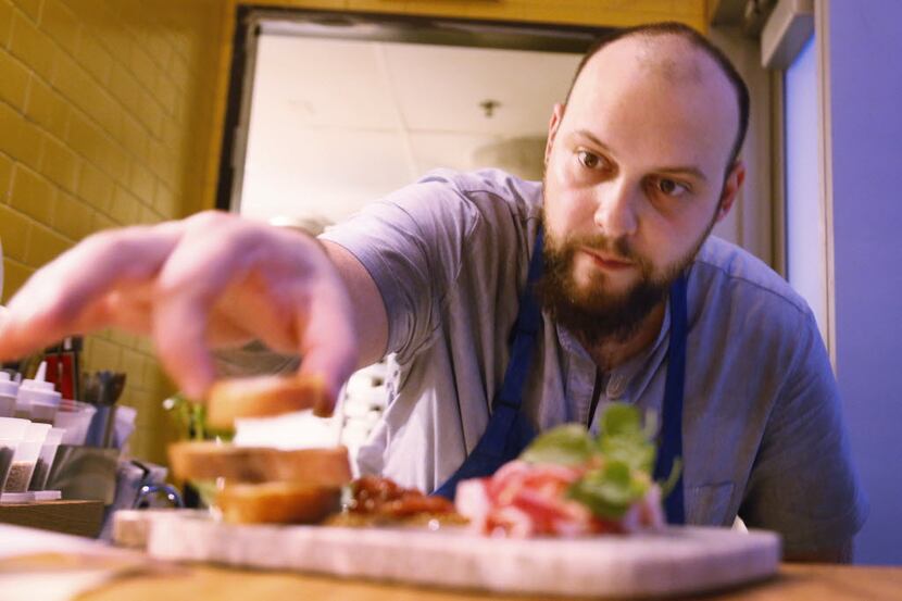 Executive chef Kyle McClelland puts the final touches on a dish.