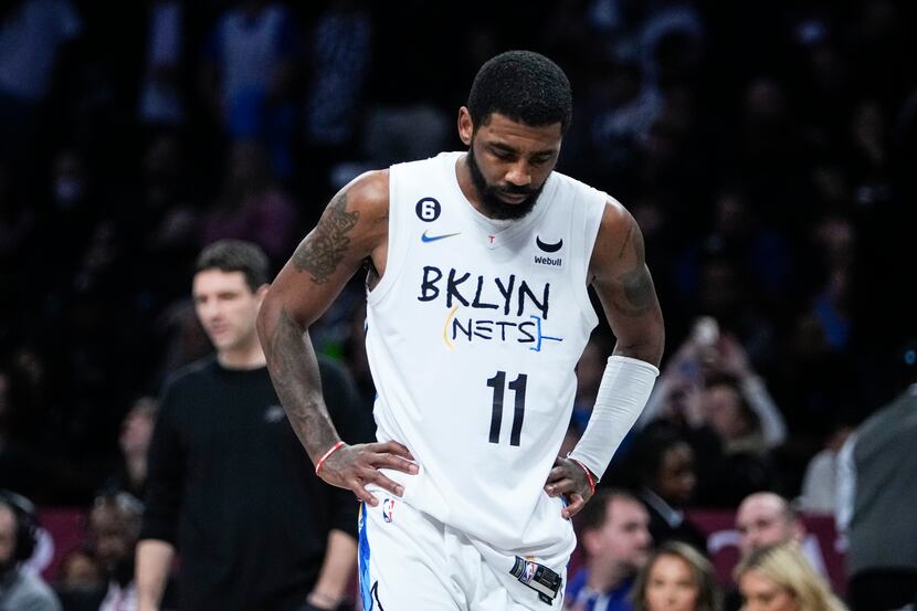 Brooklyn Nets' Kyrie Irving (11) reacts during the second half of an NBA basketball game...