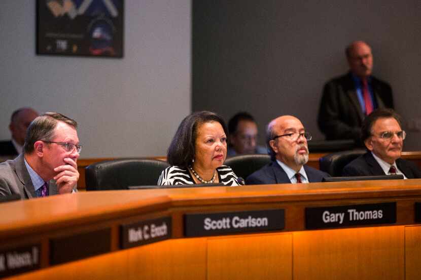The board of the Dallas Area Rapid Transit, including Richard Carrizales (second from...