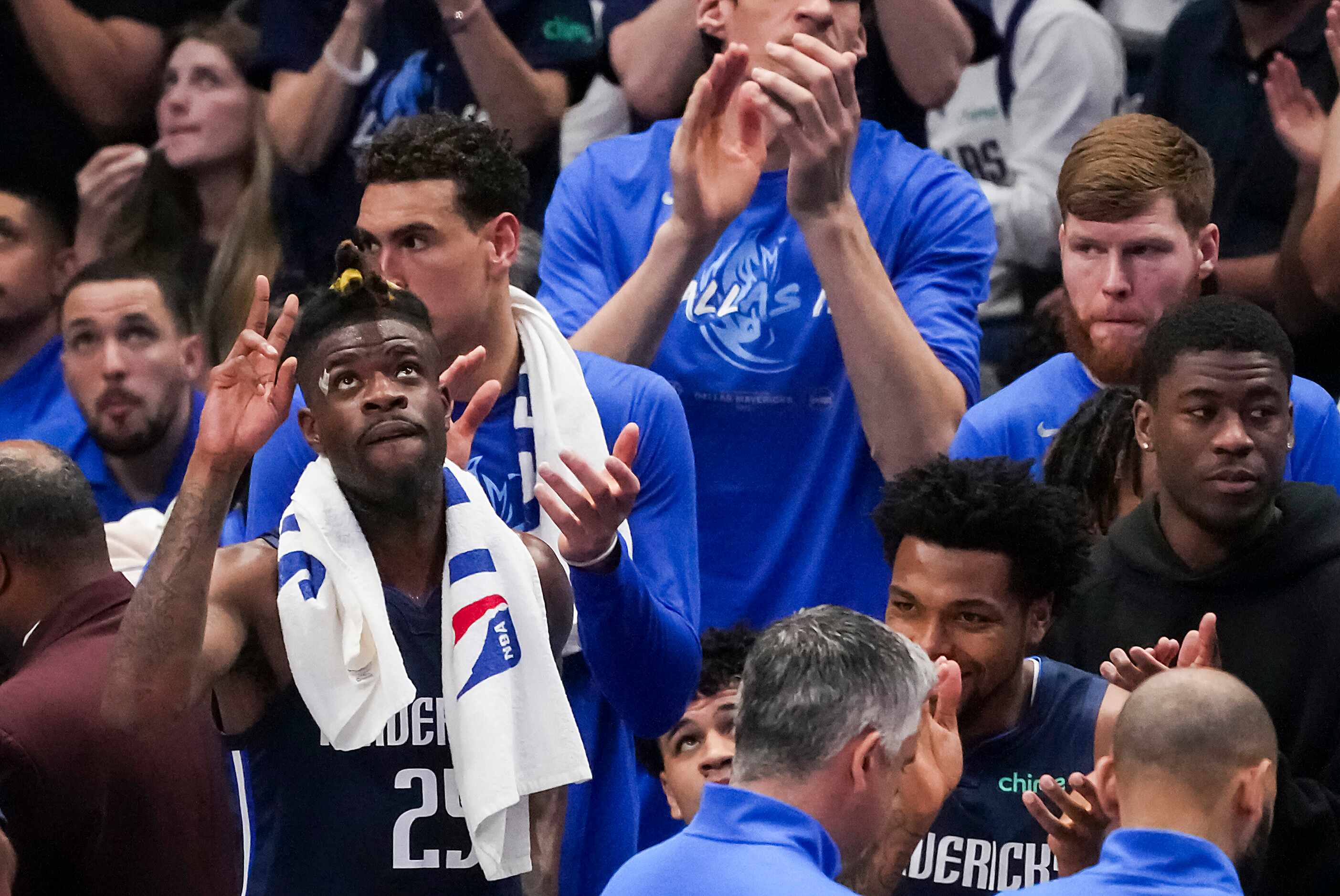 Dallas Mavericks forward Reggie Bullock acknowledges the crowd after he was honored for...