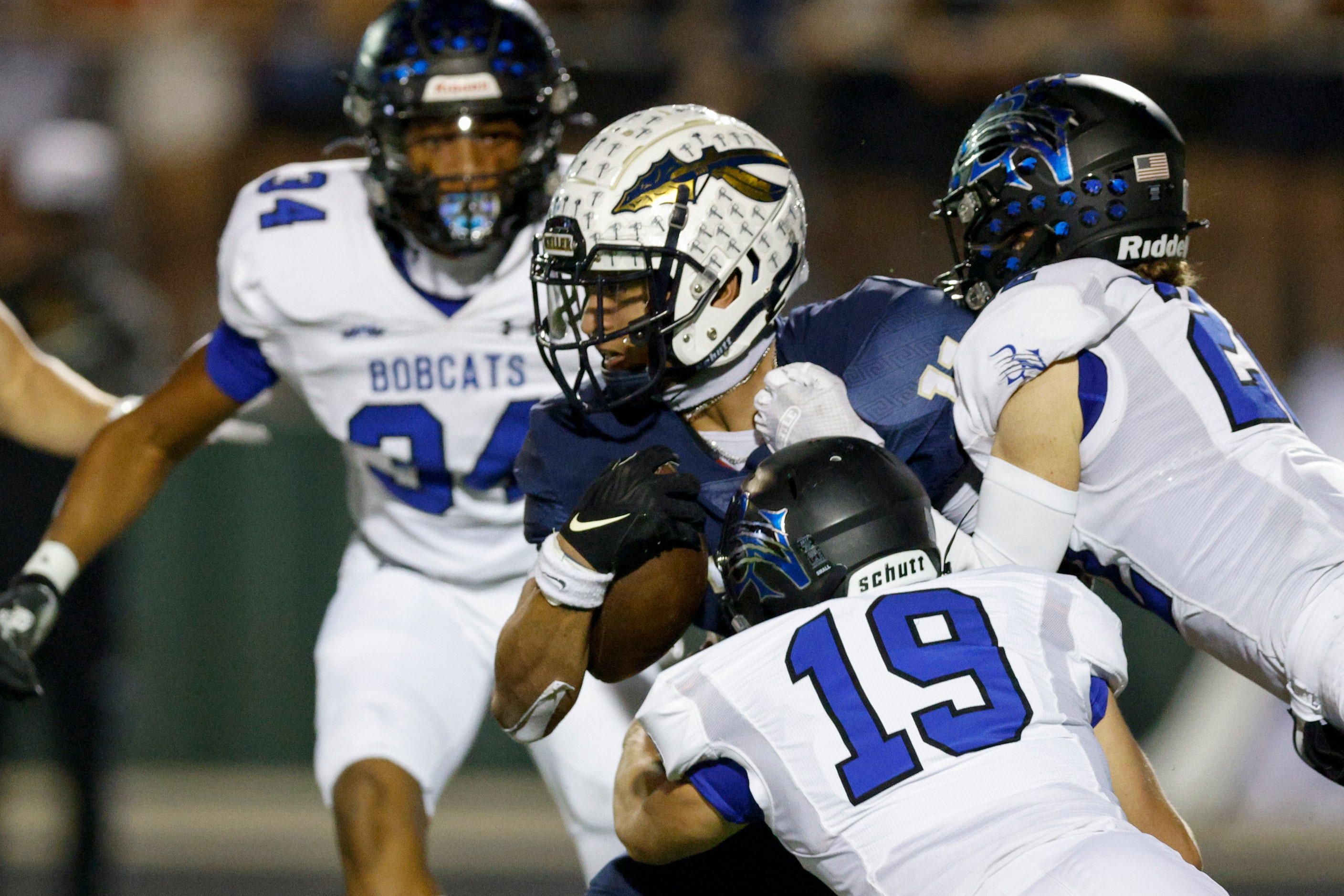 Trophy Club Byron Nelson’s Zach Nowroozi (19) and Blayne Johnson (22) tackle Keller wide...