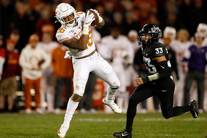 Texas running back Keaontay Ingram catches a 22-yard touchdown pass in front of Iowa State...