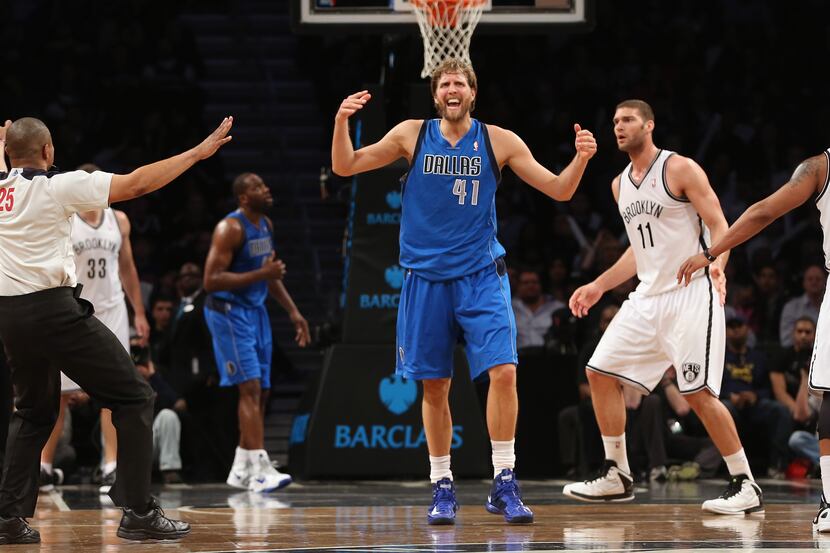 Dirk Nowitzki #41 of the Dallas Mavericks argues a call in the fourth quarter during the...