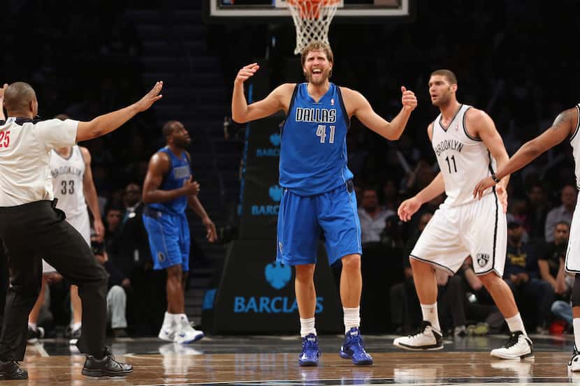Dirk Nowitzki #41 of the Dallas Mavericks argues a call in the fourth quarter during the...